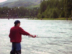travisbear Travis fishing with brown bear across river
