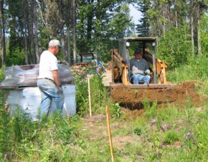 2-bobcatdigpit Digging pit with front loader